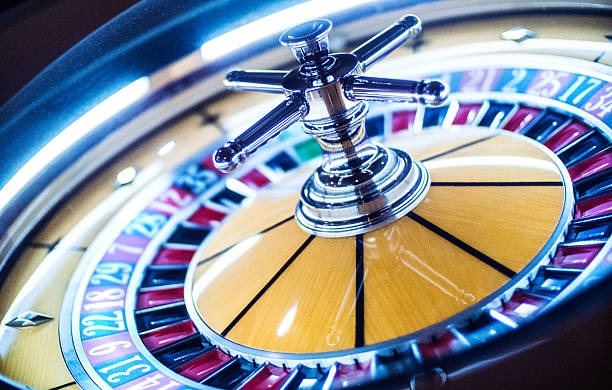 Live baccarat dealer concentrating on cards